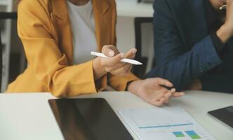 Financial Business team present. Business man hands hold documents with financial statistic stock photo, discussion, and analysis report data the charts and graphs. Finance Financial concept photo