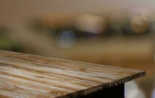 Empty wooden table in front of abstract blurred background of coffee shop . can be used for display or montage your products.Mock up for display of product photo