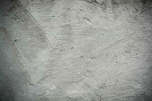 Texture of old rustic wall covered with gray stucco. Abstract background for design. photo