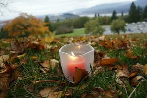 Burning candle in Burnaby Mountain Park, Vancouver, British Columbia, Canada photo