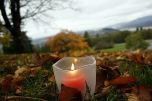 Burning candle in Burnaby Mountain Park, Vancouver, British Columbia, Canada photo