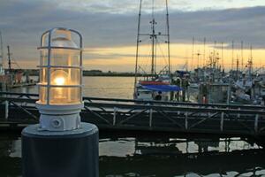 Lamp and fishing boats in Richmond, British Columbia, Canada photo
