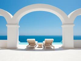 Two sunbeds on the white terrace with an arch under blue clear sky photo