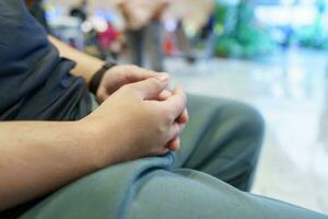 Man waiting for flight in airport departure area at airport waiting the flight photo