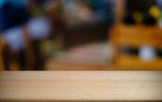 Empty dark wooden table in front of abstract blurred bokeh background of restaurant . can be used for display or montage your products.Mock up for space. photo