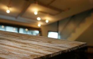 Empty wooden table in front of abstract blurred background of coffee shop . can be used for display or montage your products.Mock up for display of product photo