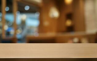 Empty dark wooden table in front of abstract blurred bokeh background of restaurant . can be used for display or montage your products.Mock up for space. photo