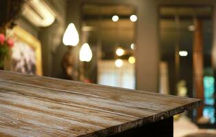 Wood Table Top in Blur Background room interior with empty copy space. photo