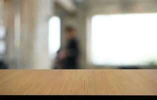 Wood Table Top in Blur Background room interior with empty copy space. photo