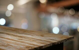 Empty dark wooden table in front of abstract blurred bokeh background of restaurant . can be used for display or montage your products.Mock up for space. photo