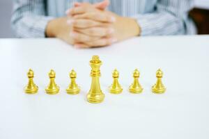 Human resources concept career management with clasped hands planning strategy with chess figures. photo