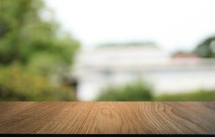 Empty wooden table in front of abstract blurred background of coffee shop . can be used for display or montage your products.Mock up for display of product photo