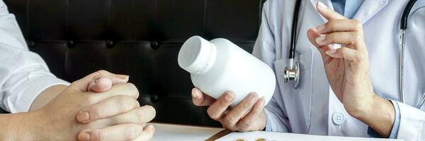 Health care Doctor giving medicine to patient for arthritis pain. photo