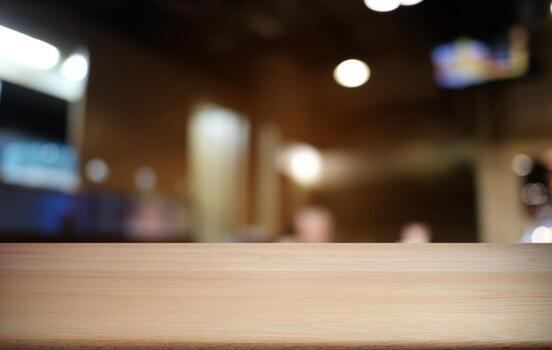 Empty dark wooden table in front of abstract blurred bokeh background of restaurant . can be used for display or montage your products.Mock up for space. photo