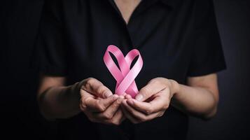 Doctor Hands Holding Pink Cancer Awareness Ribbon, photo