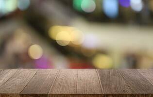 Empty wooden table in front of abstract blurred background of coffee shop . can be used for display or montage your products.Mock up for display of product photo