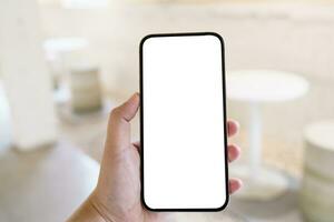 Women's hands holding cell telephone blank copy space screen. smartphone with blank white screen isolated. smart phone with technology concept. photo