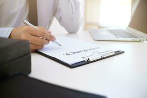 Sales manager giving advice application form document, considering mortgage loan offer for car and house insurance. photo