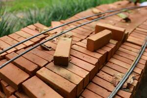 Pallet a red brick building material stack of new red bricks for construction. photo