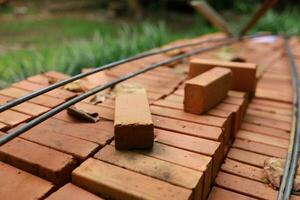 Pallet a red brick building material stack of new red bricks for construction. photo