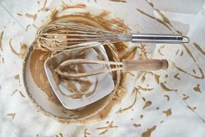 Whip and after preparation of sweet dishes photo