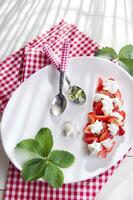 Strawberries with whipped cream photo