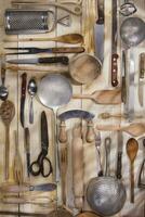 a bunch of different utensils on a table photo