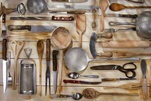 a bunch of different utensils on a table photo