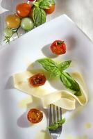 Pappardelle pasta with basil and tomato photo