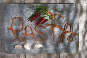 Pasta on a stone for advertising photo