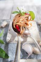 Spaghetti with garlic, oil and chili photo