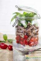 Pasta with tomato sauce and basil photo