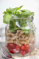 Pasta with tomato sauce and basil photo