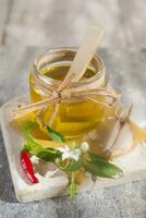 Olive oil, garlic and chili photo