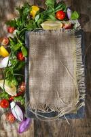 a plate with a fork and knife sitting on top of a wooden table photo