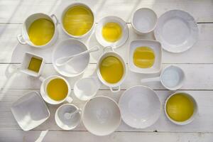 Small containers with extra virgin olive oil photo