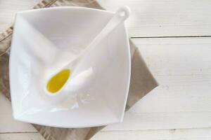 Small containers with extra virgin olive oil photo