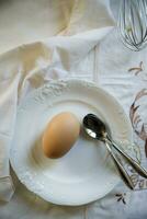 Egg on white plate photo