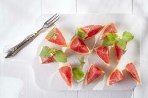 Slices of red grapefruit photo