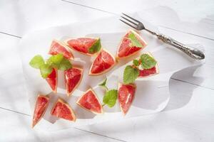 Slices of red grapefruit photo