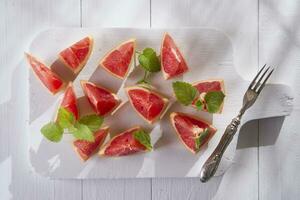 Slices of red grapefruit photo