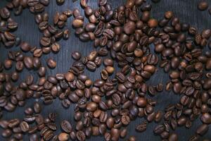 coffee beans are scattered on a table photo