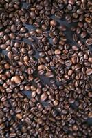 coffee beans on a dark wooden table photo