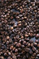 coffee beans on a dark wooden table photo