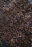 coffee beans on a dark wooden table photo