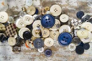 a pile of buttons on a table photo
