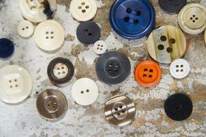 a pile of buttons on a table photo