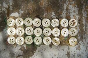 a pile of buttons on a table photo