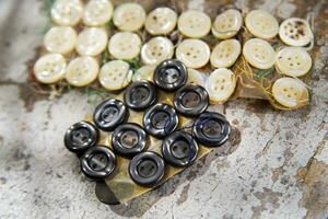 a pile of buttons on a table photo