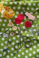 a pile of buttons on a white table photo